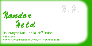 nandor held business card